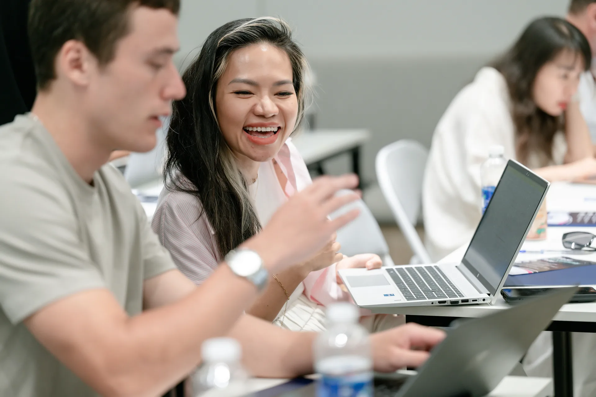 Cohort members smiling during a break