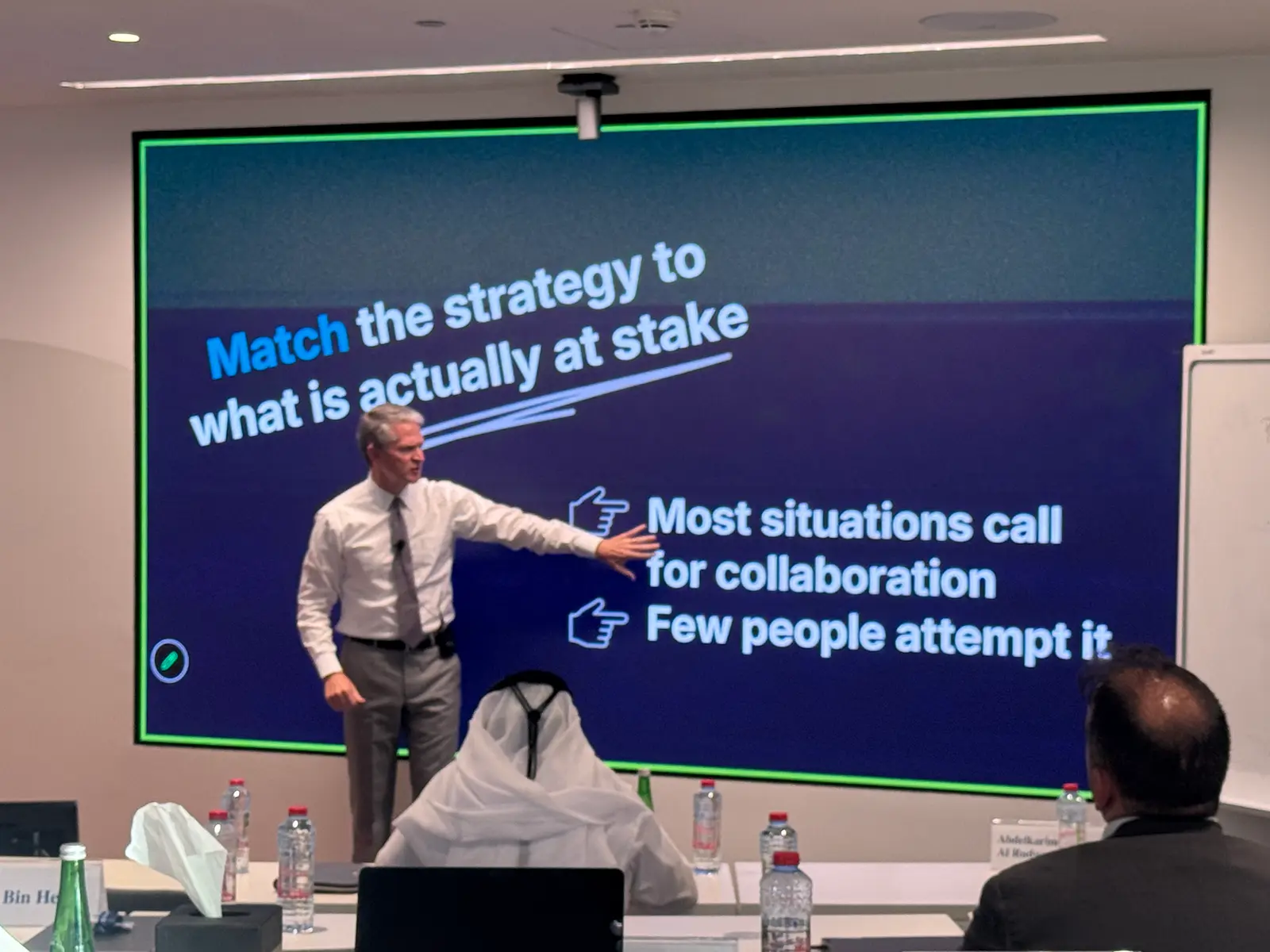 Dr. Brooks Holtom speaking to the room in Dubai